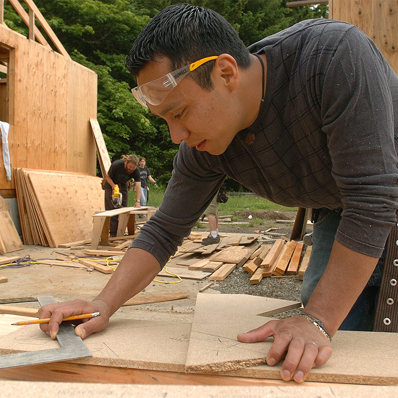Student working in a building construction class