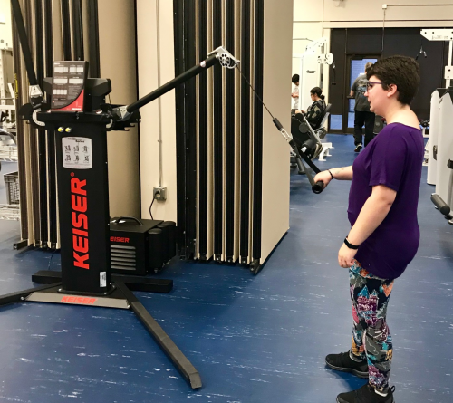 Woman with specialized gym equipment