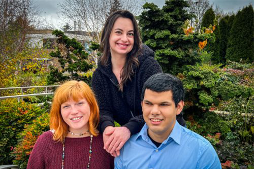 Three DCA students smiling together