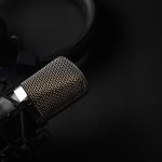 Black and White Photo of Microphone and Headset