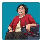 Judy Heumann wearing a red sweater, sitting in her wheelchair, and smiling.