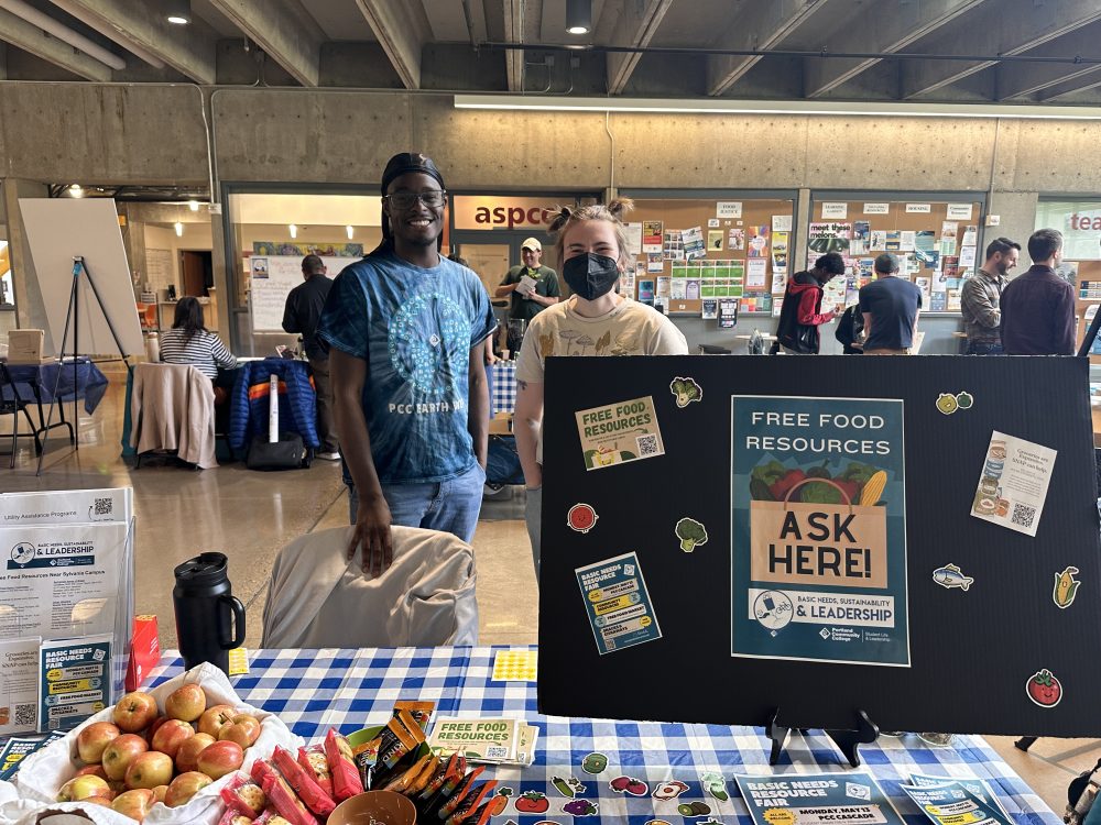 Photo: Student interns share information about free food resources at a campus resource fair