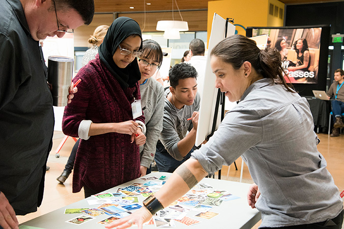 Students looking at photos of campus