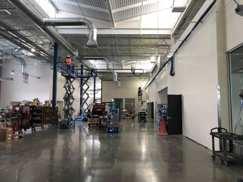 Interior, open manufacturing area showing polished concrete floors