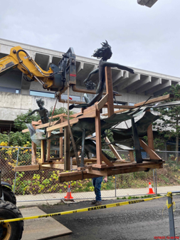 Outdoor sculpture being relocated