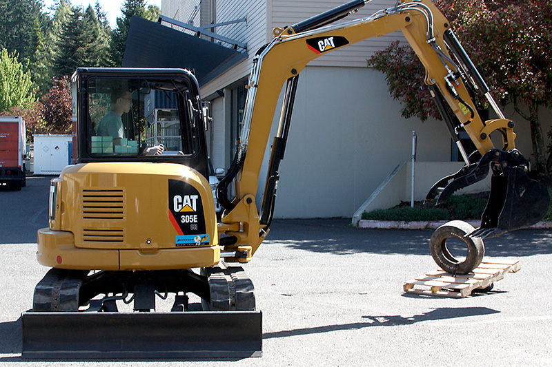 Student driving a CAT machine