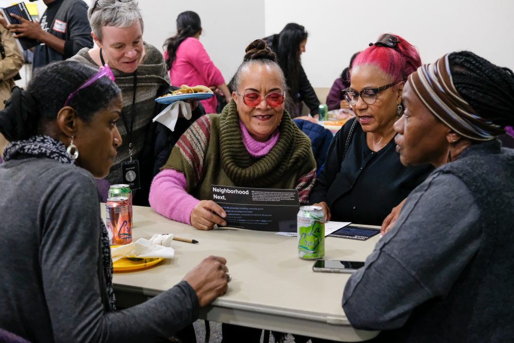 Staff members gathered discussing the future of the center