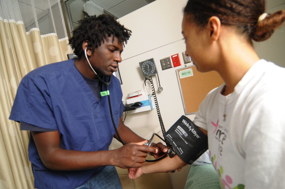 Nursing students practicing taking the blood presssure