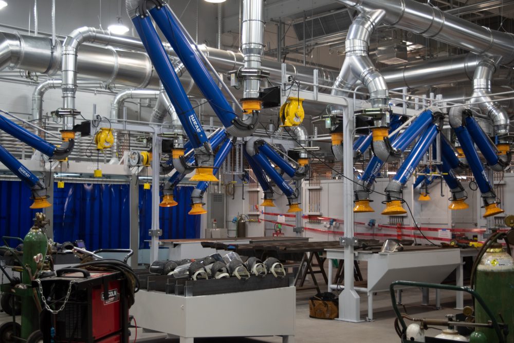 Rock Creek Weld shop under remodel showing the manifold exhaust system and cutting areas