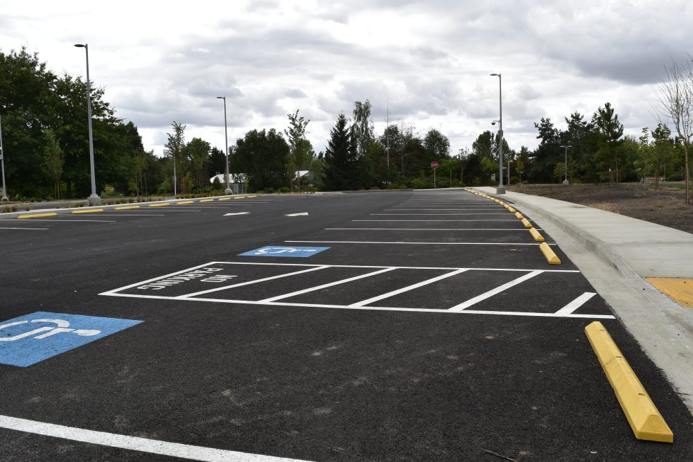 Stripes denoting parking spaces looking at ADA spots