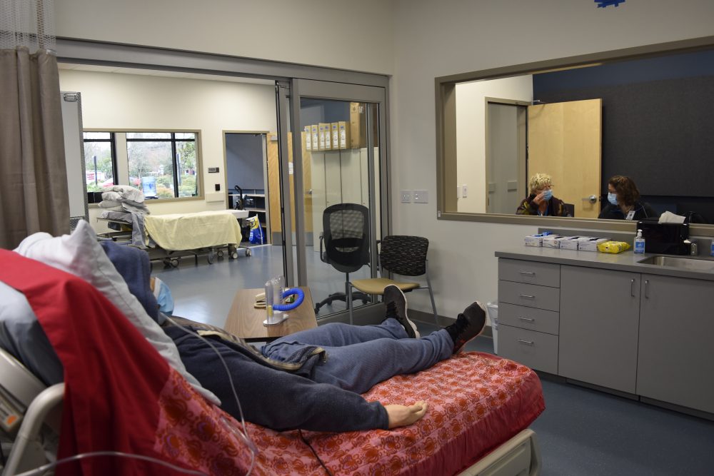 View from inside the patient room into the hallway and the control booth where the scenarios for the simulation are managed