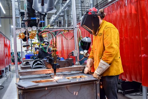 Student welding at OMIC