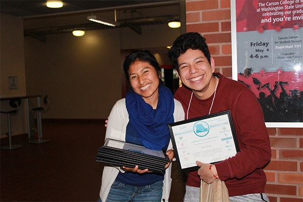 Student holding a certificate of achievement