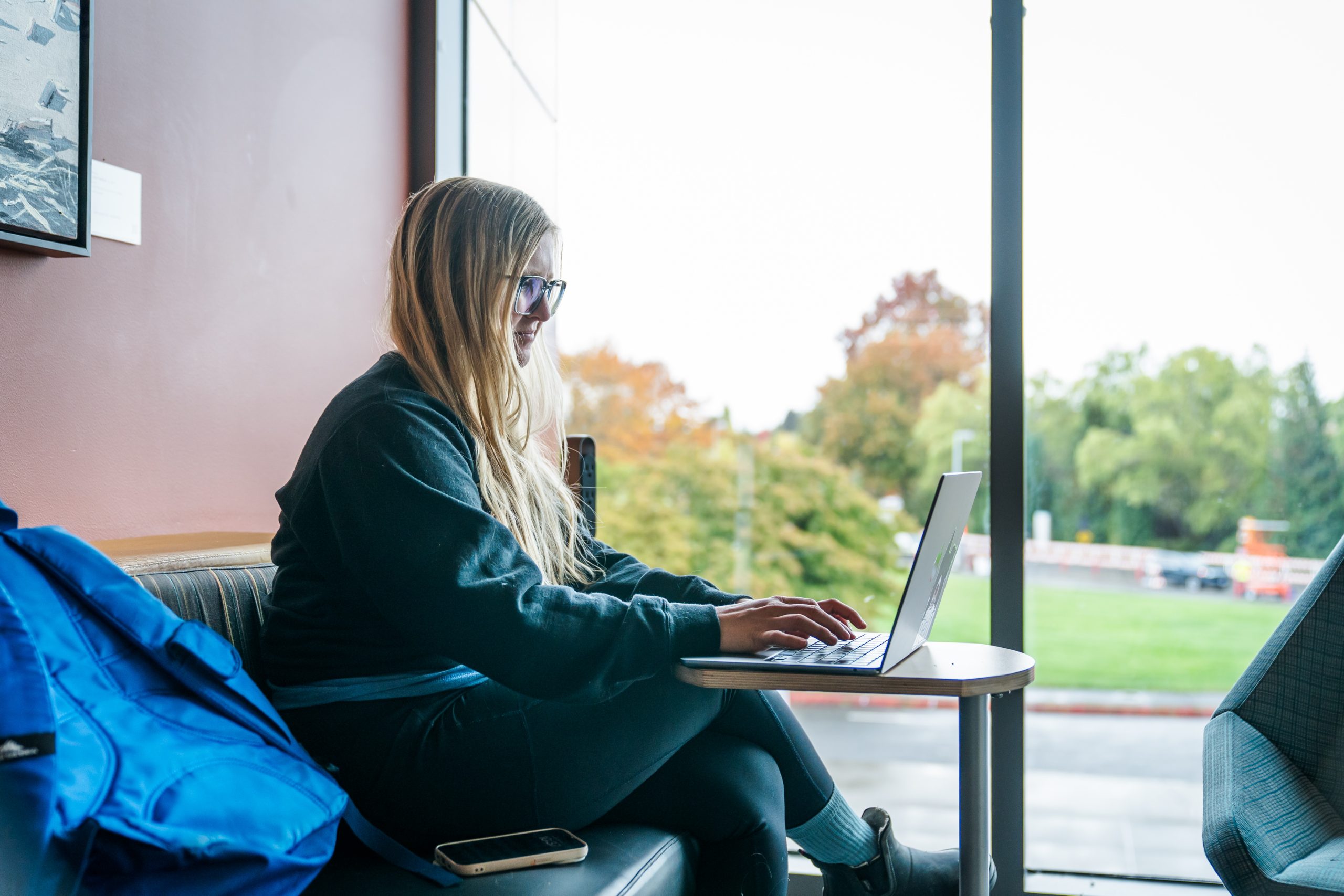 Student types at laptop at PCC library