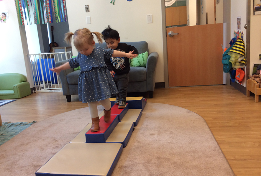 Toddlers on balance beam