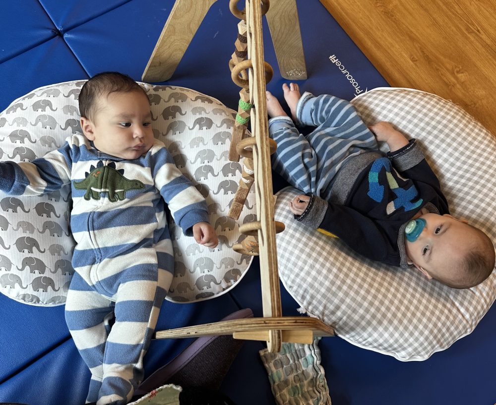 Two babies laying down