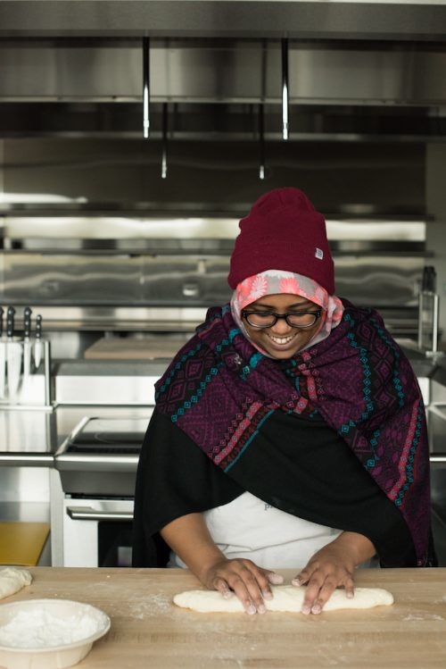 PCC student kneading bread