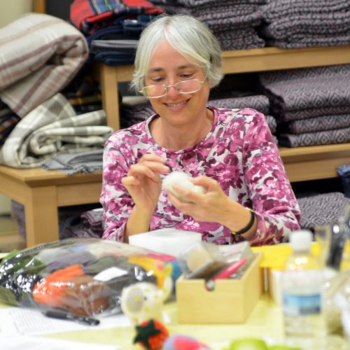 woman demonstrating wool felting