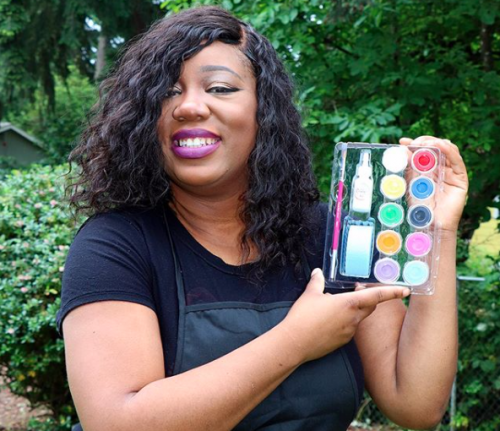 PCC instructor holding teen facepainting kit
