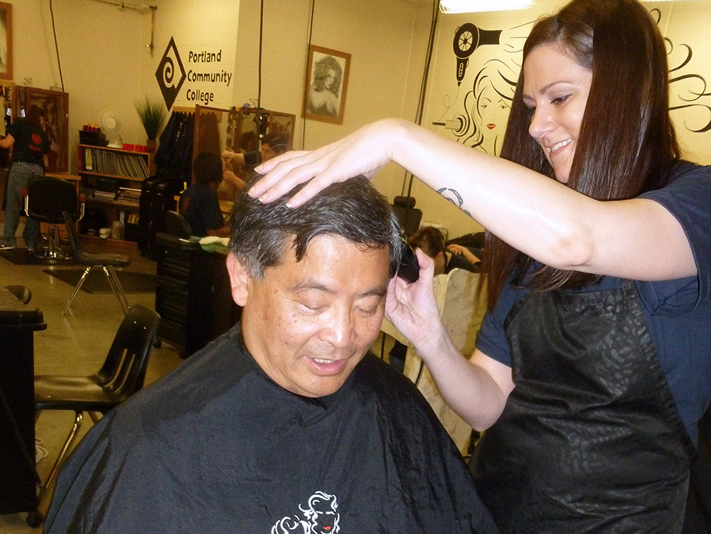 PCC President Mitsui getting a haircut