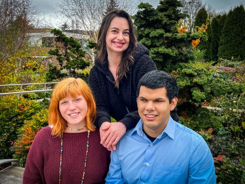 Three students smiling together