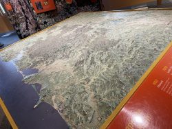 The Tillamook Forest Center's tactile topographic map inside the Main Hall display center. The map provides a tactile experience of the mountain ranges and breadth of land contained in the Tillamook State Forest. 