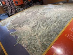 The Tillamook Forest Center's tactile topographic map inside the Main Hall display center. The map provides a tactile experience of the mountain ranges and breadth of land contained in the Tillamook State Forest. 