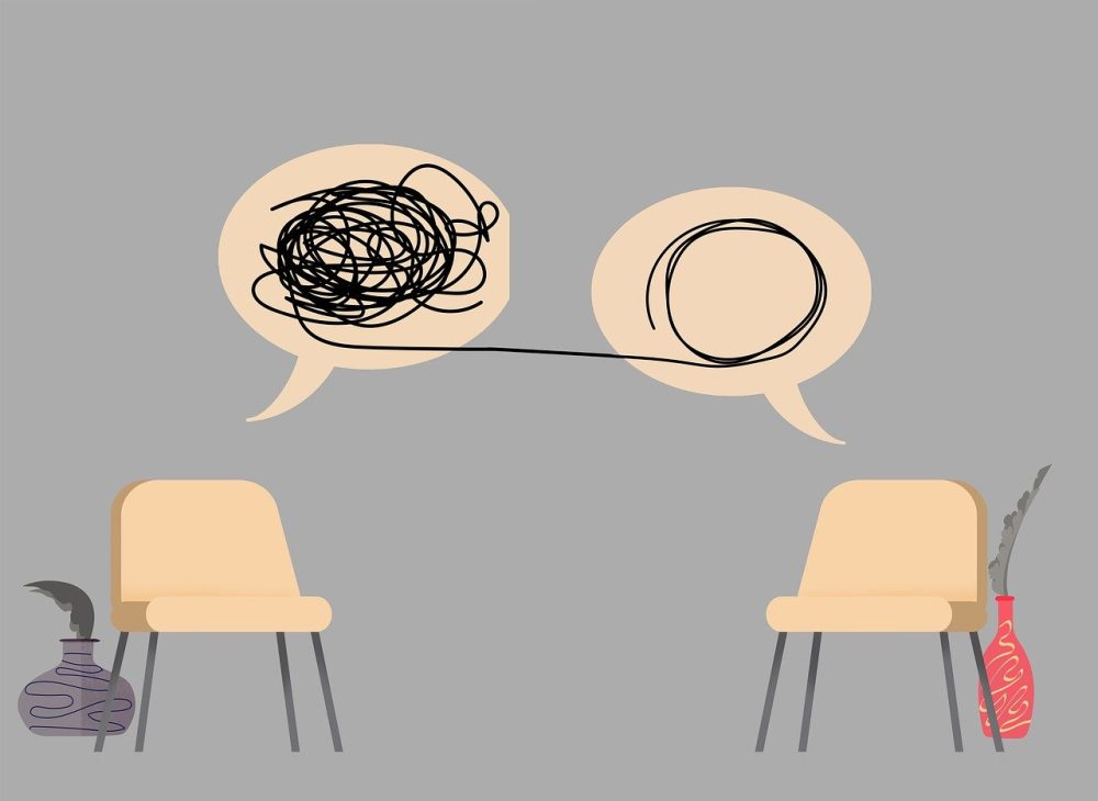 Two chairs with speech bubbles above them, representing a disconnected conversation between two individuals.