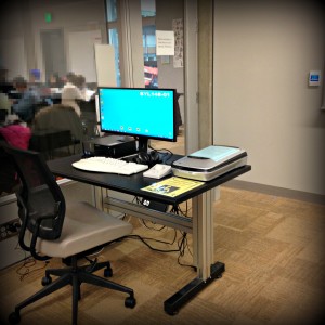 Computer is in Room 145 located near the whiteboards in the front of the room. As you face the whiteboard the height adjustable table and workstation is on your left.