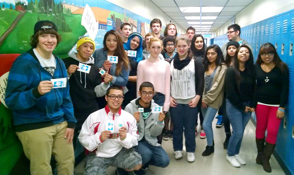 Group of students in a high school hallway posing together