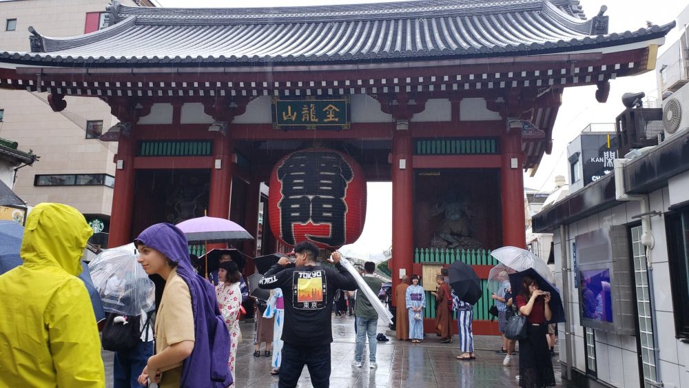Photo of student in front of the Asuka Shrine in Japan