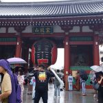 Photo of student in front of the Asuka Shrine in Japan