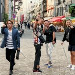 Image of 4 teenagers in busy street