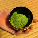 Close up image of green tea grounds