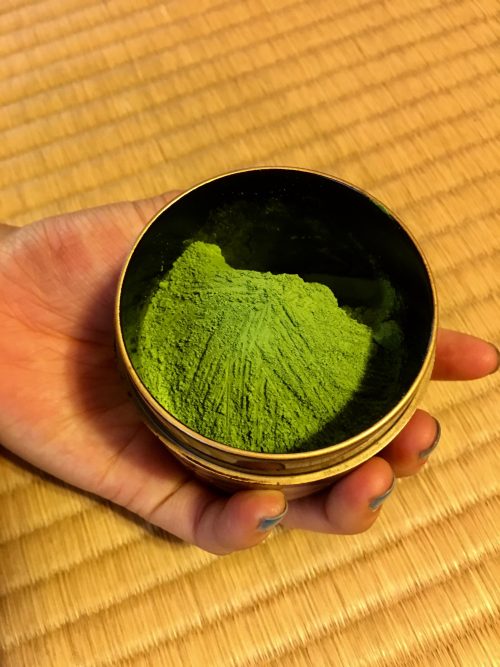 Close up image of green tea grounds