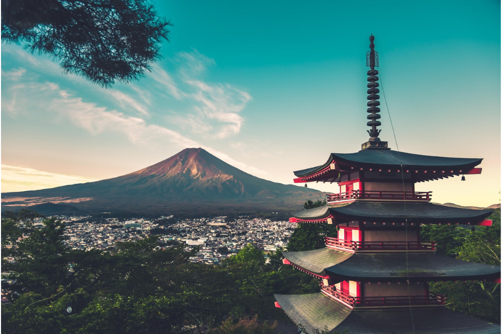 a traditional Japanese temple in front of Mt. Fuji