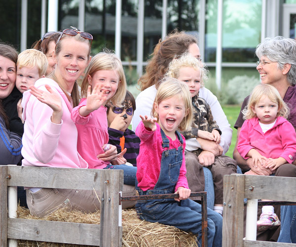 Families riding in hay cart