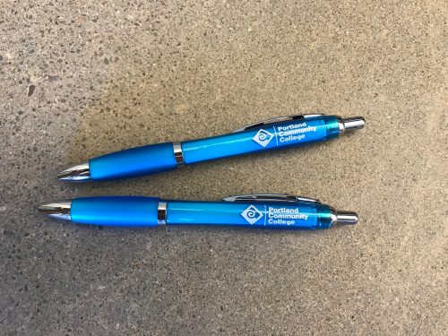 Turquoise pens with a white PCC logo