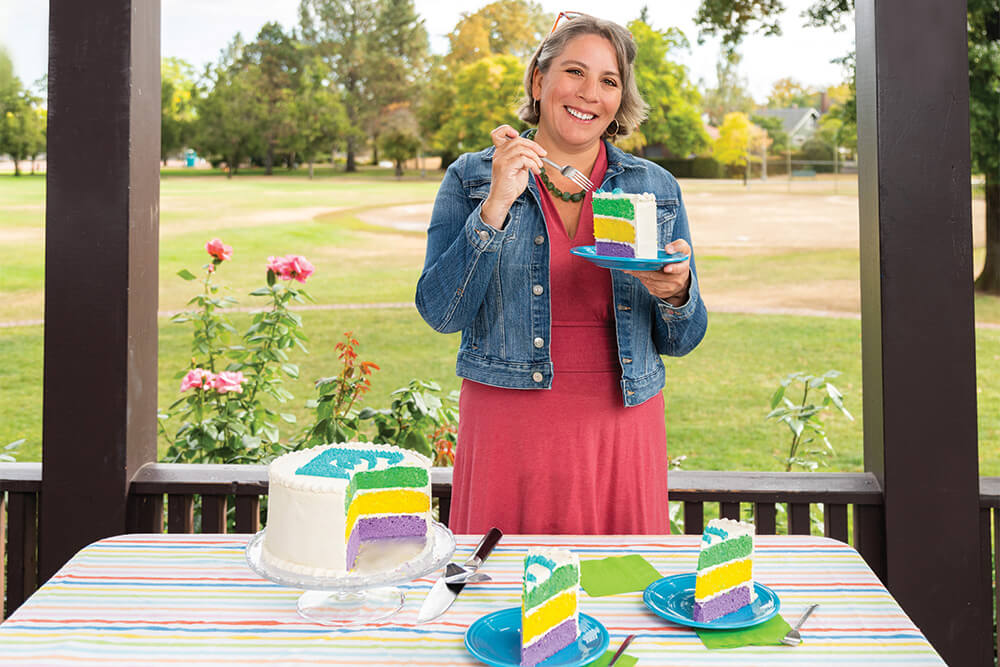 Belle eating a piece of colorful cake