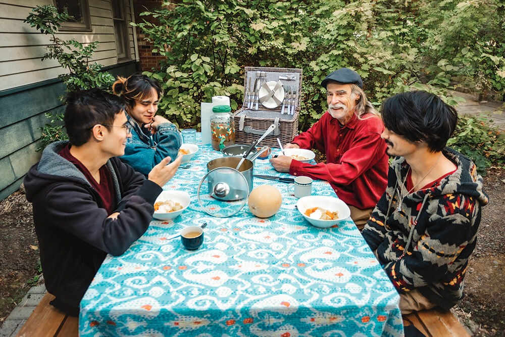 Francis eating curry with his kids