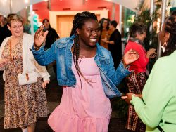 A guest dances among a crowd