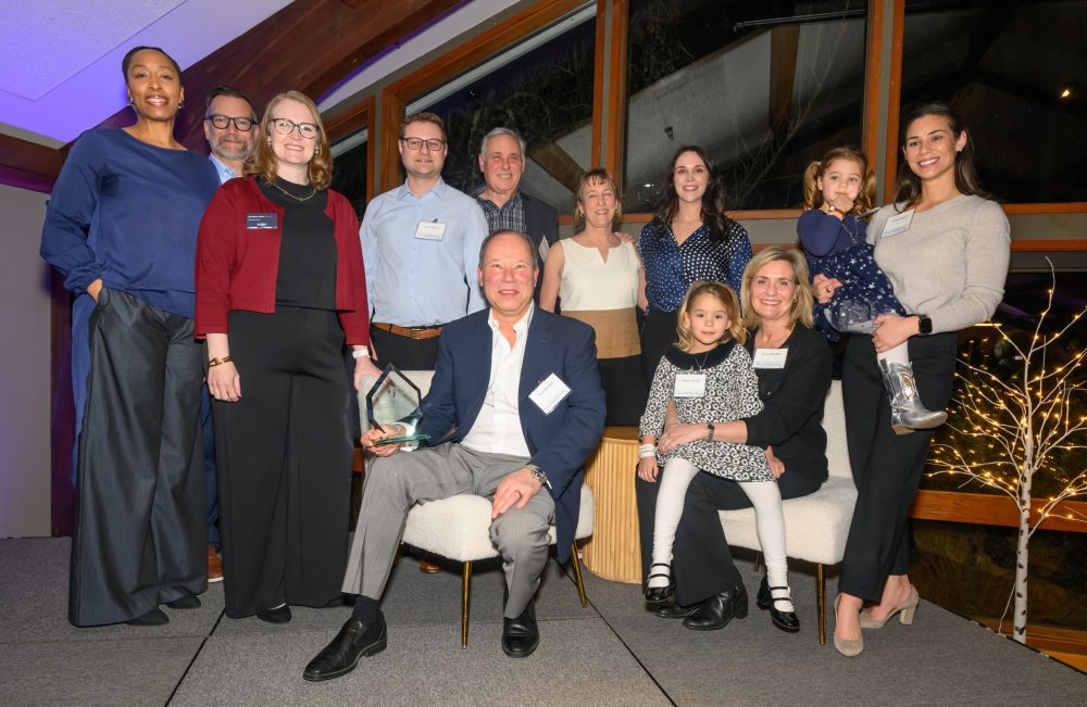A group of people smiling at camera.