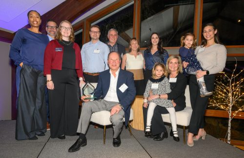 A group of people smiling at camera.