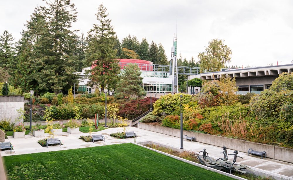 The exterior of the Performing Arts Center on the PCC Sylvania Campus, overlooking a grassy lawn and outdoor art sculptures.