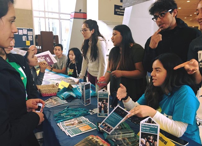 Students handing out brochures