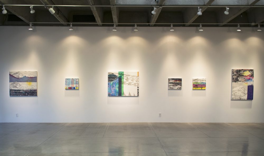 Gallery wall with six abstract, landscape paintings ranging in size from 16 by 20n inches to 36 by 45 inches.