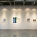 Gallery wall with six abstract, landscape paintings ranging in size from 16 by 20n inches to 36 by 45 inches.