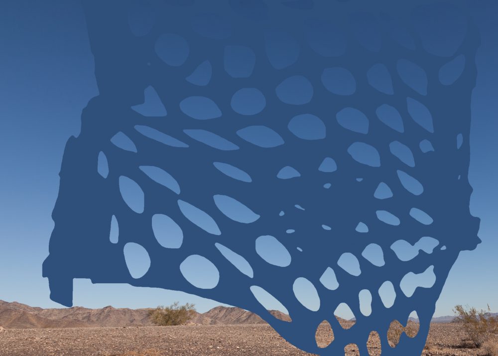 Photograph of desert landscape with blue sky; in the foreground is an abstract form, a layer of blue with circular holes that reveal the blue sky behind it.