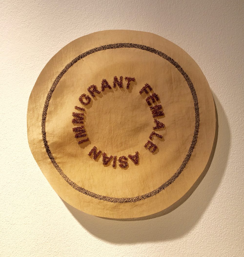 FEMALE ASIAN IMMIGRANT Fabric with hand embroidery and beads