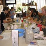 Combustible materials and other elements are used in hopes of some chemical transfer to the unglazed clay surface during the pit firing.